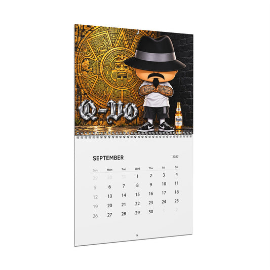 Vatos 2027 wall calendar by Printify featuring a colorful design, hung on a wall with pages visible for monthly planning.